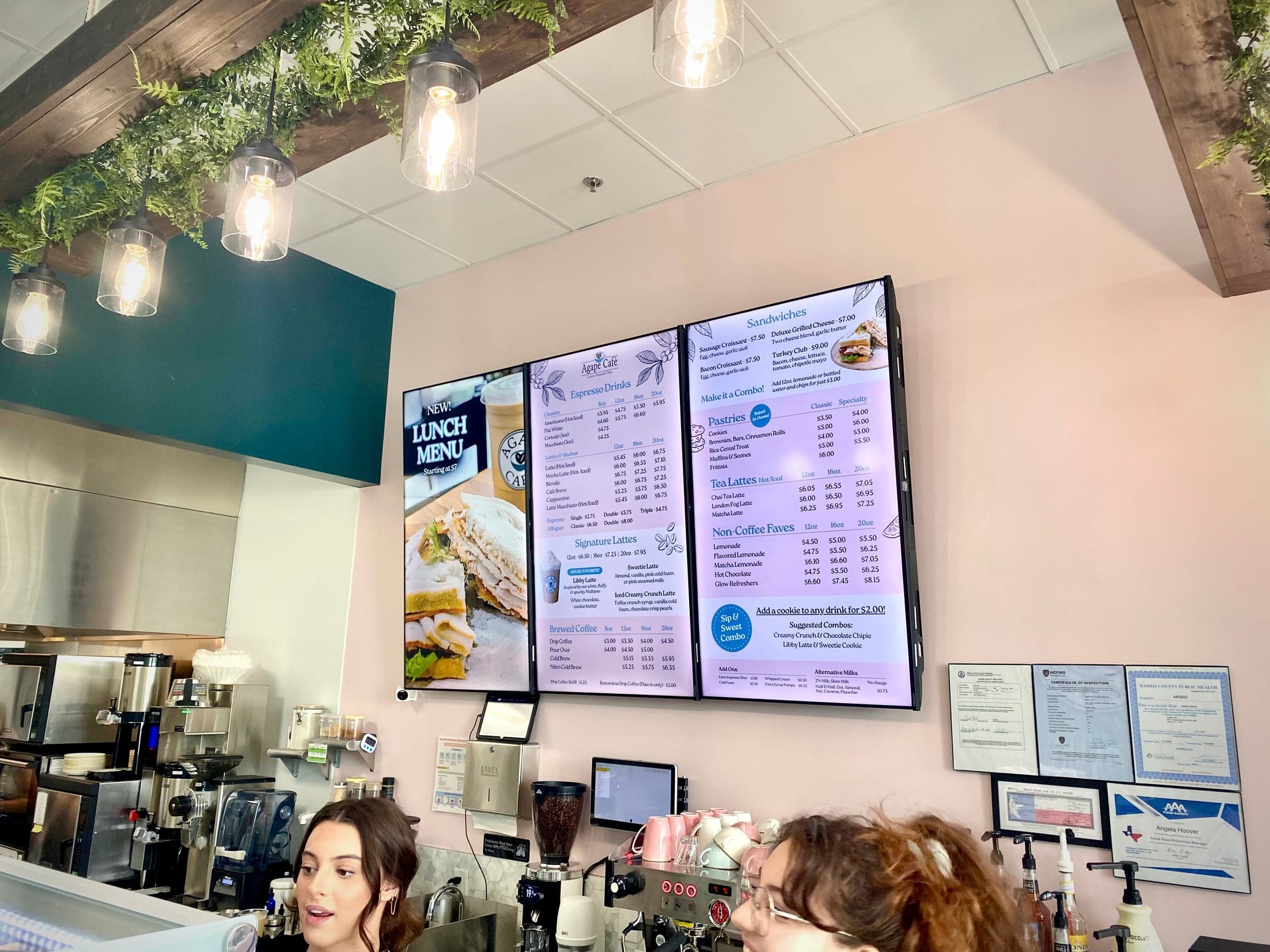 Three-screen digital menu system installed inside Agape Café